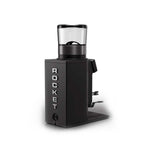 A black Rocket coffee grinder with a clear bean hopper on a white background.